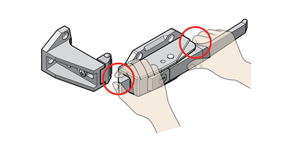 Be careful not to pinch your fingers at the base of the latch or lever